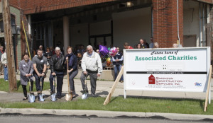 Lori Overmyer, Joe Reep, Greg Gorrell, Rosemarie Donley and Steve Englet participate in a ceremonial groundbreaking Wednesday for the new location of Associated Charities.